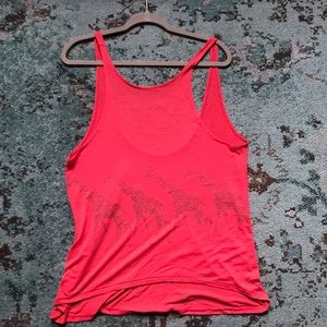 Red rank top with giraffe print.